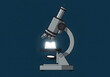 © Arif - Microscope with illuminated book for science and education
