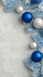 © Nunthaphuk - Elegant Christmas Background Design for Seasonal Marketing – Elegant Blue and Silver Christmas Ornaments with Snowy Background