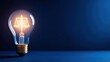 © chusnul - A glowing light bulb featuring a scale symbolizing justice, set against a dark blue background