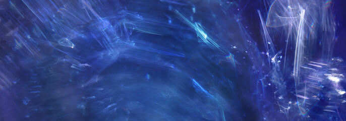Wall Mural - Background of purple and blue lens flare lights. Abstract image
