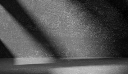 Wall Mural - Dark light gray background with cement wall texture. Minimalist abstract background for product presentation with soft shadows from the window.