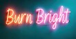 © antishock - Neon sign displays text Burn Bright. Vivid colors contrast against teal wall. Simple, modern aesthetic. Inspiring message.