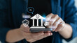 © K2LStudio - Businessman using smartphone with hologram showing AI banking system, fintech, cybersecurity, and digital finance. Concept of artificial intelligence in business technology