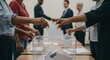 © tiago - Hands of different ages and ethnicities casting ballots into a transparent box in a bright polling station; handshake in background; sense of unity and civic duty.”