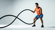 © Milan - A strong Asian man doing a battle rope exercise in a fitness studio. Muscular athlete during a powerful crossfit workout on a white background with copy space.