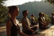 © Vitalii Shkurko - Participants engage in a group meditation session outdoors at sunrise, surrounded by lush trees and soft morning light. Each individual is finding their inner peace through mindfulness and relaxation