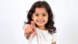 © Falah - Smiling little girl with dark, curly hair, points forward with her index finger, looking at the viewer