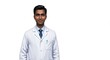 © Qstock - Confident Male Doctor Wearing White Lab Coat and Tie