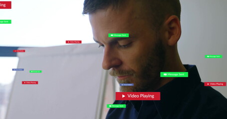 Standing man in dark shirt viewing office with Message Sent media playing notifications, copy space