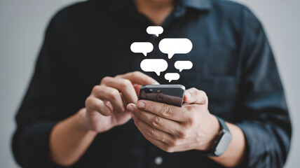Man using smartphone with message bubbles, communicating, texting, connecting