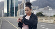 © Jordi P DE/peopleimages.com - Plus size woman, smart watch and city with fitness, heart rate and timer app for exercise on bridge. Person, runner and check stats with stopwatch, training and routine for weight loss in Costa Rica