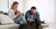 © peopleimages.com - Home, dog and couple on sofa, love and bonding together with coffee, relax and relationship. Apartment, pet owner and man with woman, canine and comfort with domestic animal, best friend and smile