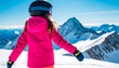 © Andrey - Young girl in a pink ski jacket and helmet stands on a snowy mountain, looking at the peaks in the distance. Clear blue sky and bright sunlight enhance the winter scene.