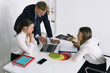 © Sergey - Business team collaborates on project analysis in modern office space during work hours