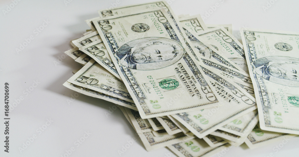 Stack, salary and cash on table for fraud crime, money laundering and ...