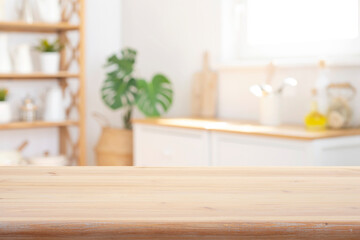 Wall Mural - Close-up wooden table top on blurred bright rustic kitchen interior background