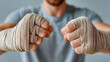 © MAX - a close-up shot of hands wrapped in boxing tape, ready for a fight. This image captures the intensity and readiness of a fighter