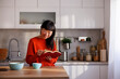 © Impact Photography - Woman reading a book while relaxing at home