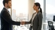 © sorariku - Smiling businessman and businesswoman shaking hands in a modern office, eye level , symbolizing a successful partnership agreement or deal, copy space