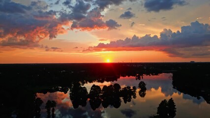 Sticker - A Brilliant and Beautiful Orange Sunset Over The River In Tampa, Florida - Slow and Steady Aerial Shot