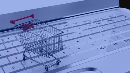 Wall Mural - composition of shopping cart over laptop