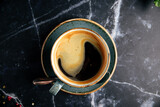 Cup of americano coffee on stone table background