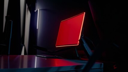 A computer monitor sitting on top of a desk next to a keyboard