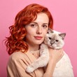 © Suqun - Woman with cat, soft focus, studio portrait