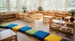 © AnjumanAra - Photo of bright and spacious montessori classroom filled with wooden shelves, tables, and colorful cushions, creating an inviting and stimulating environment for early childhood education and learning