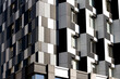 © Artem Kniaz - solar panel geometric front side facade commerce high rise skyscraper building monochrome black and white modern architecture background corner
