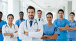 © Kaluya Stock - Smiling medical team in a hospital corridor, standing with arms crossed, symbolizing collaboration, expertise, and dedication in healthcare