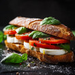 © Spice - 9:16 aspect ratio, premium studio shot of a gourmet sandwich made with slices of fresh mozzarella (firm and creamy, not runny), layered with ripe tomato slices, fresh basil leaves, and a drizzle of ol