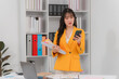© Kritdanai - Asian Businesswoman Using Smartphone in Office