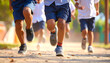 © adomon - A view of the feet of elementary school children running on the playground