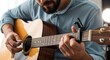 © Pixel Stone - Man Playing an Acoustic Guitar Learning Music Hobby