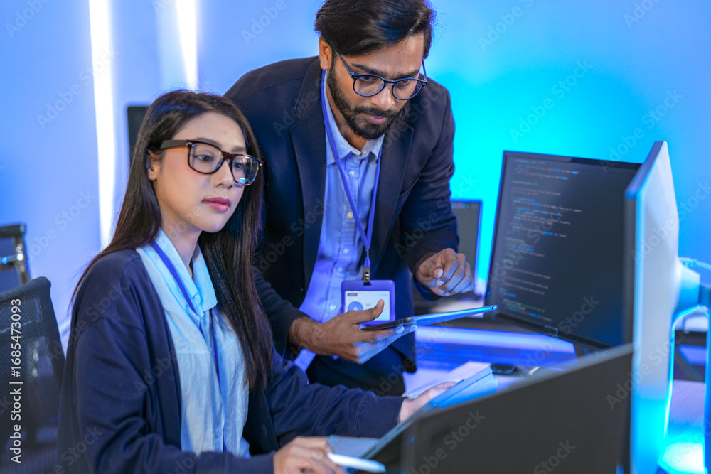 AI engineer developing algorithms in a futuristic data center. The blue ...