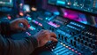 © Anas - Sound engineer expertly mixing audio on complex console during live event production.