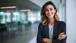 © Elena - Professional woman smiling in modern office