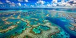 © MST MURSHIDA BEGUM - Aerial view of the great barrier reef, a world heritage site in queensland, australia, showcasing its vibrant coral formations and turquoise waters under a sunny sky