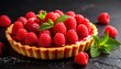© Олег - A large raspberry tart with a buttery crust and a bright red raspberry filling, topped with fresh raspberries and mint leaves on a dark stone background. The concept of a festive sweet dessert.