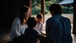 © Echt&KIreativ - Japanese family sharing a quiet moment together in traditional home