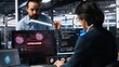© DC Studio - Server hub engineers alarmed by cyberattack accessing confidential data, working to secure systems. Teamworking data center colleagues fighting malware intrusion during security breach, camera A