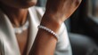 © Sans - Close-up of a woman's wrist adorned with a sparkling diamond bracelet