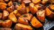 © Chotijah - Roasted sweet potato wedges with a flavorful crust.