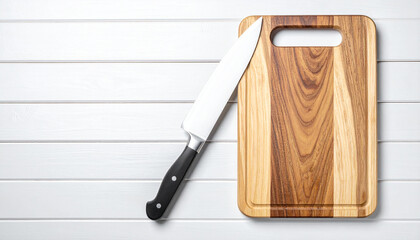 Sharp tools: A chef's knife rests elegantly on a wooden cutting board, revealing a clean aesthetic, simple composition and perfect visual story. 