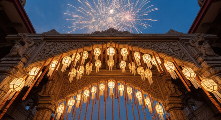 Low-angle shot of a historic archway with festive fireworks exploding against a clear blue night sky