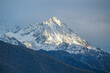 © 國樹潘 - Jagged, snowy peaks loom under a cloudy skyYala Snow Mountain, Sichuan, China