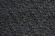© Анна Климчук - texture of dark knitted fabric with detailed pattern. Soft textile background for fashion, design, and textile industry concepts