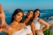 © Bohdan - Young Women Taking Selfie at the Seaside