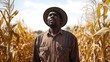 © MikeLegend - Farmer surveys golden cornfield under bright sky in autumn